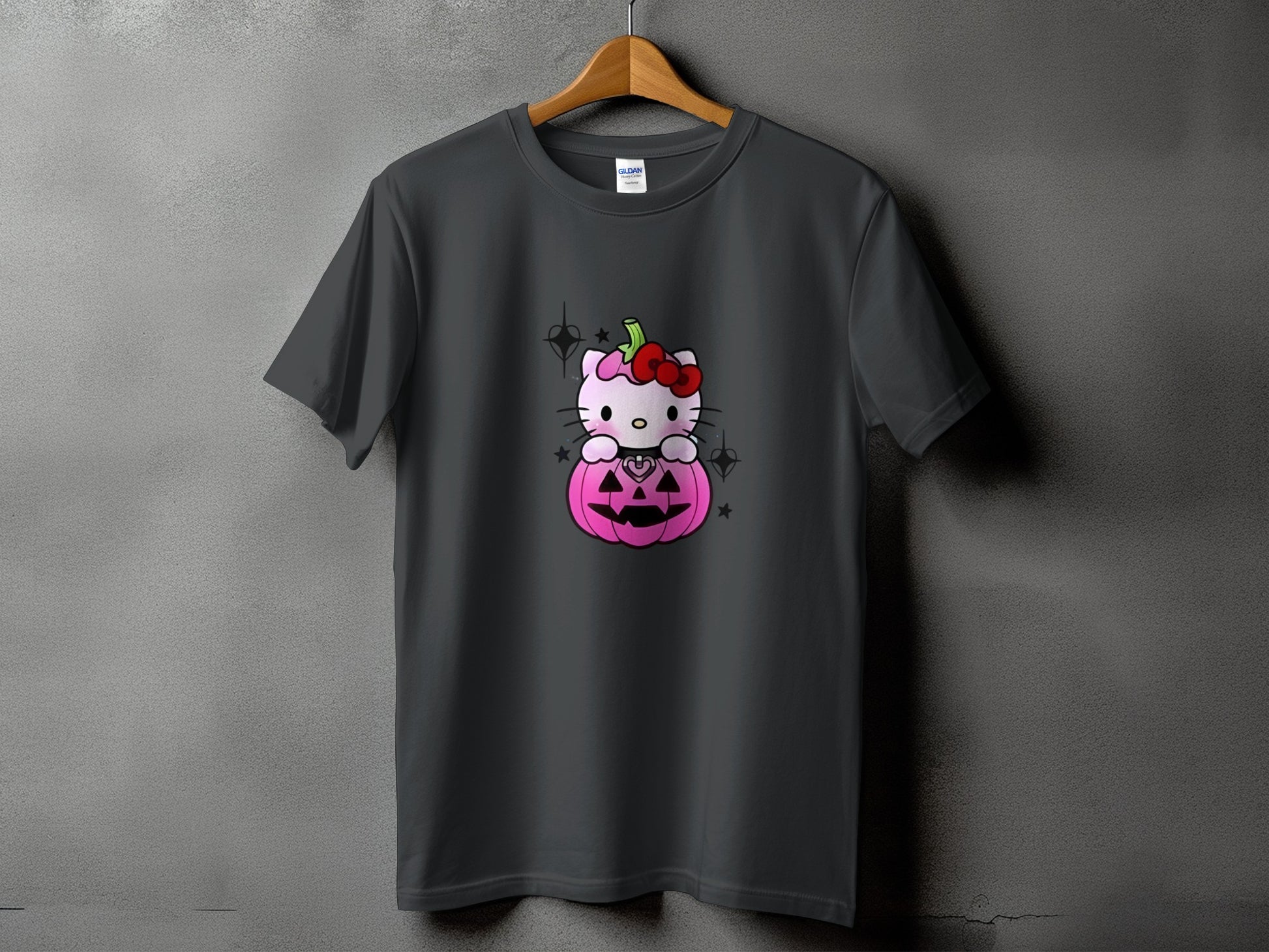 Dark grey t-shirt with Hello Kitty inside a pink jack-o'-lantern.