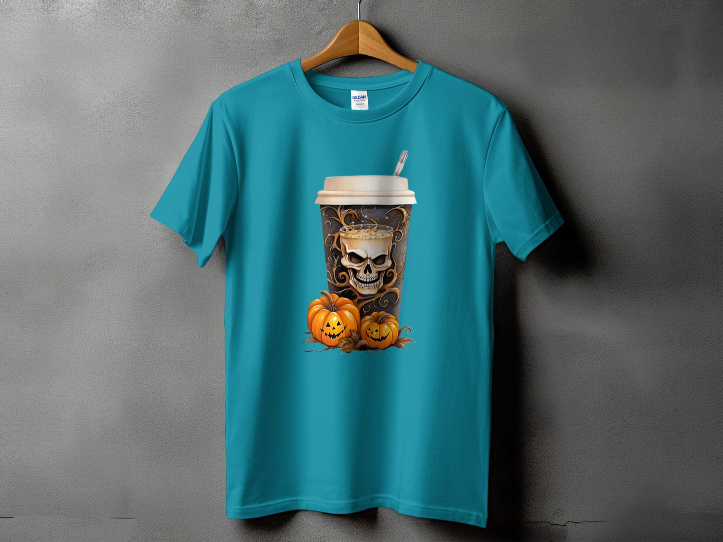 Teal t-shirt with a Halloween coffee cup design featuring a skull and pumpkins.