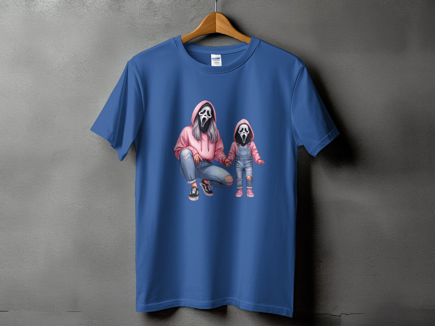 T-shirt with ghost mask characters, one adult and one child, in pink hoodies and denim.