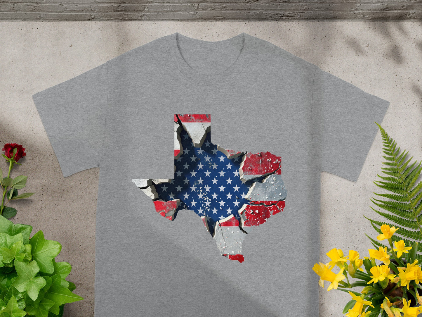 Grey t-shirt with a cracked Texas map graphic filled with the American flag.