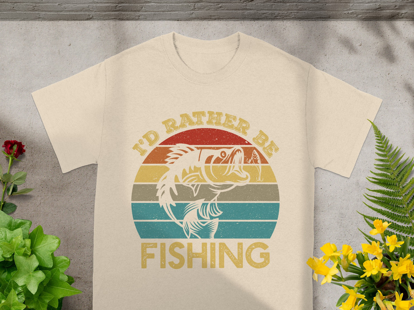 T-shirt with text "I'd Rather Be Fishing" and a jumping fish graphic.