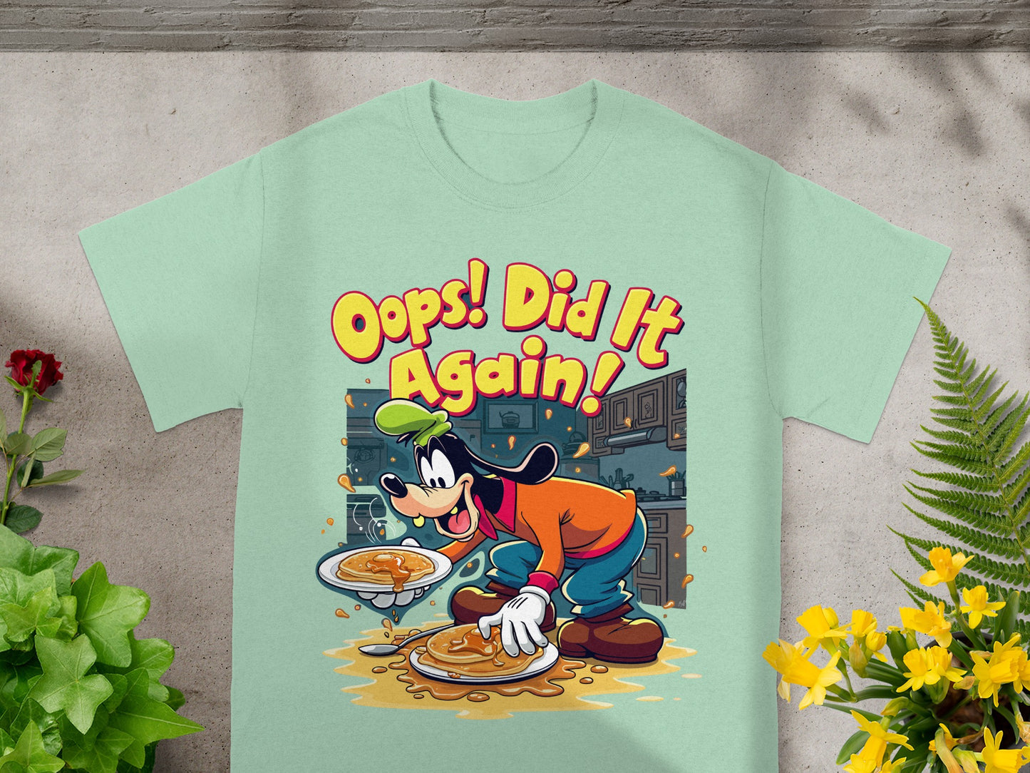 Goofy holding pancakes, with text "Oops! Did It Again!".