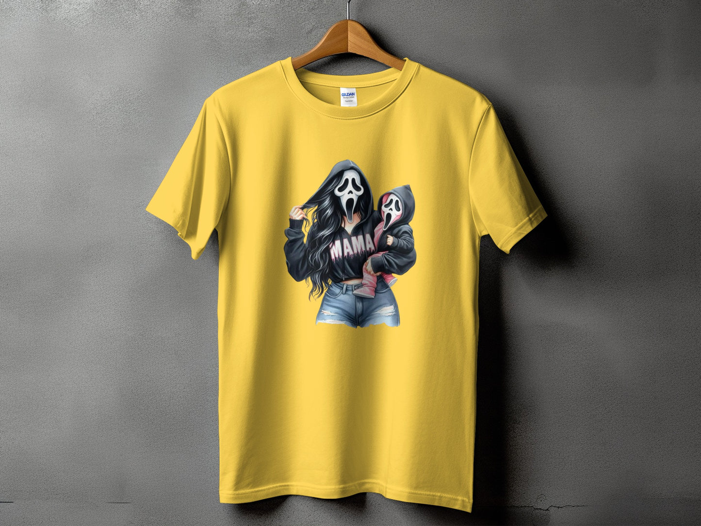 Yellow t-shirt with graphic of woman and child in Scream masks, text "MAMA"