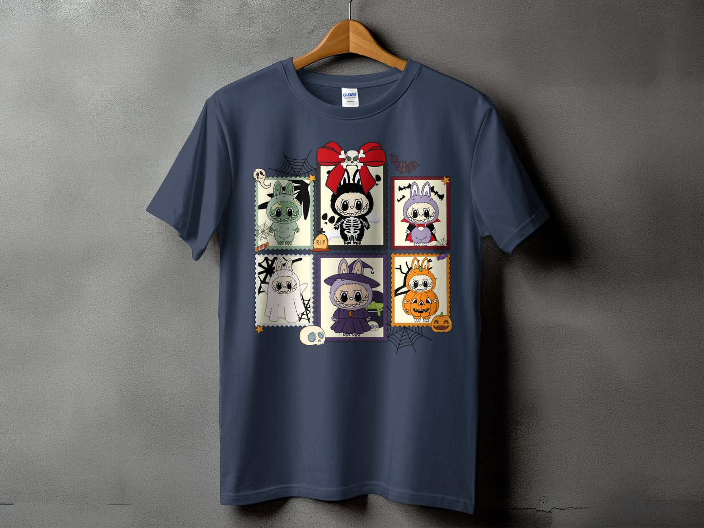 Dark blue t-shirt with a grid of six Halloween-themed character stamps.