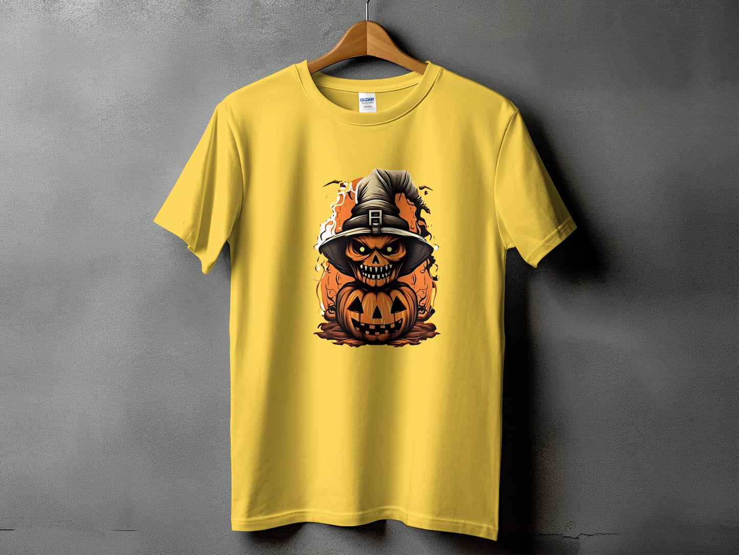 Yellow t-shirt featuring a Halloween pumpkin and witch hat graphic with flames.