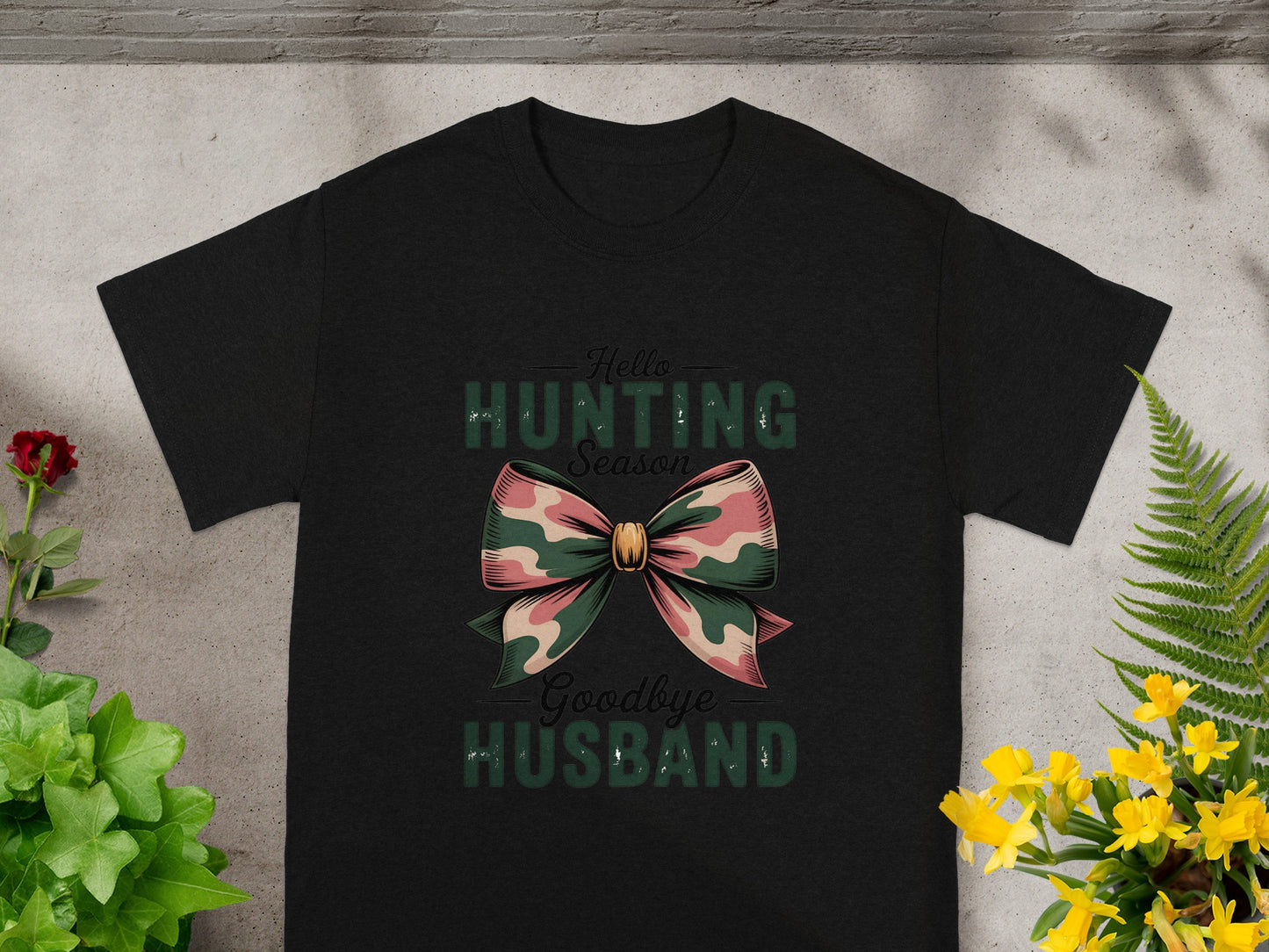 Black t-shirt with "Hello Hunting Season Goodbye Husband" text and camouflage bow.
