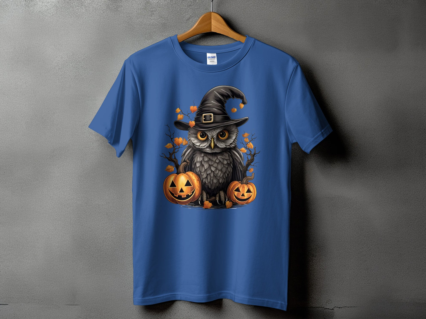 Blue t-shirt with a Halloween owl wearing a witch hat and pumpkins.