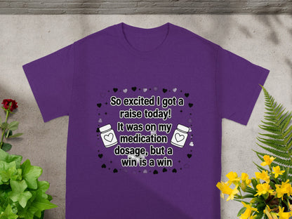 Purple t-shirt with hearts and pills, reading "So excited I got a raise today!"