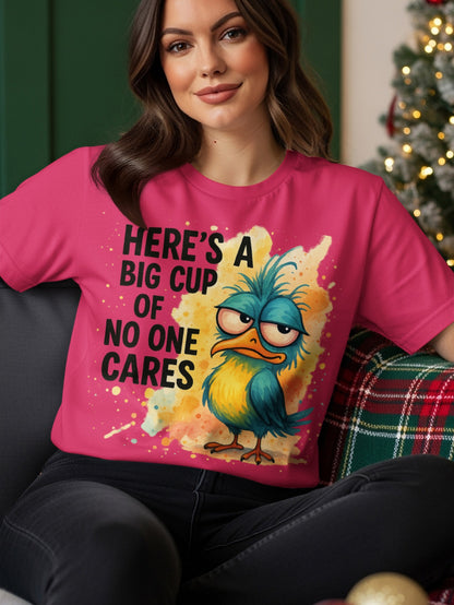 T-shirt with text "Here's a big cup of no one cares" and a grumpy cartoon bird.