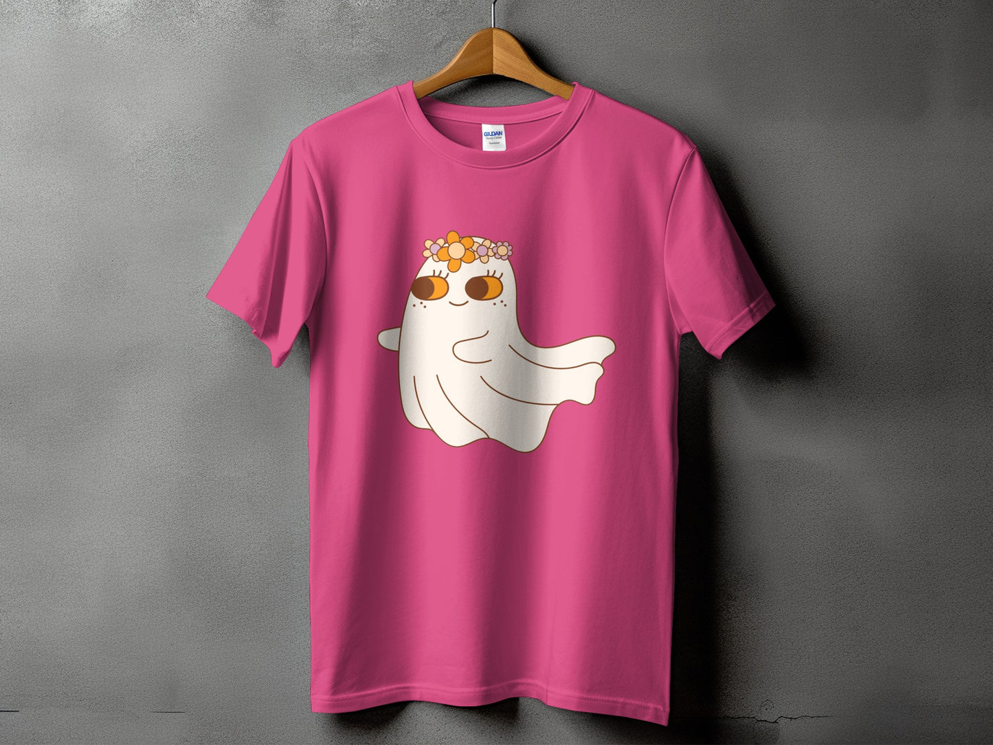 Pink t-shirt with a cartoon ghost wearing a flower crown and a faint Gildan label.