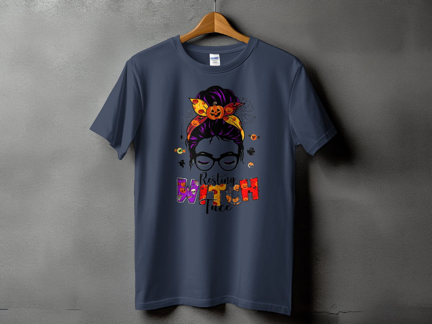 T-shirt with "Resting Witch Face" Halloween graphic and messy bun.