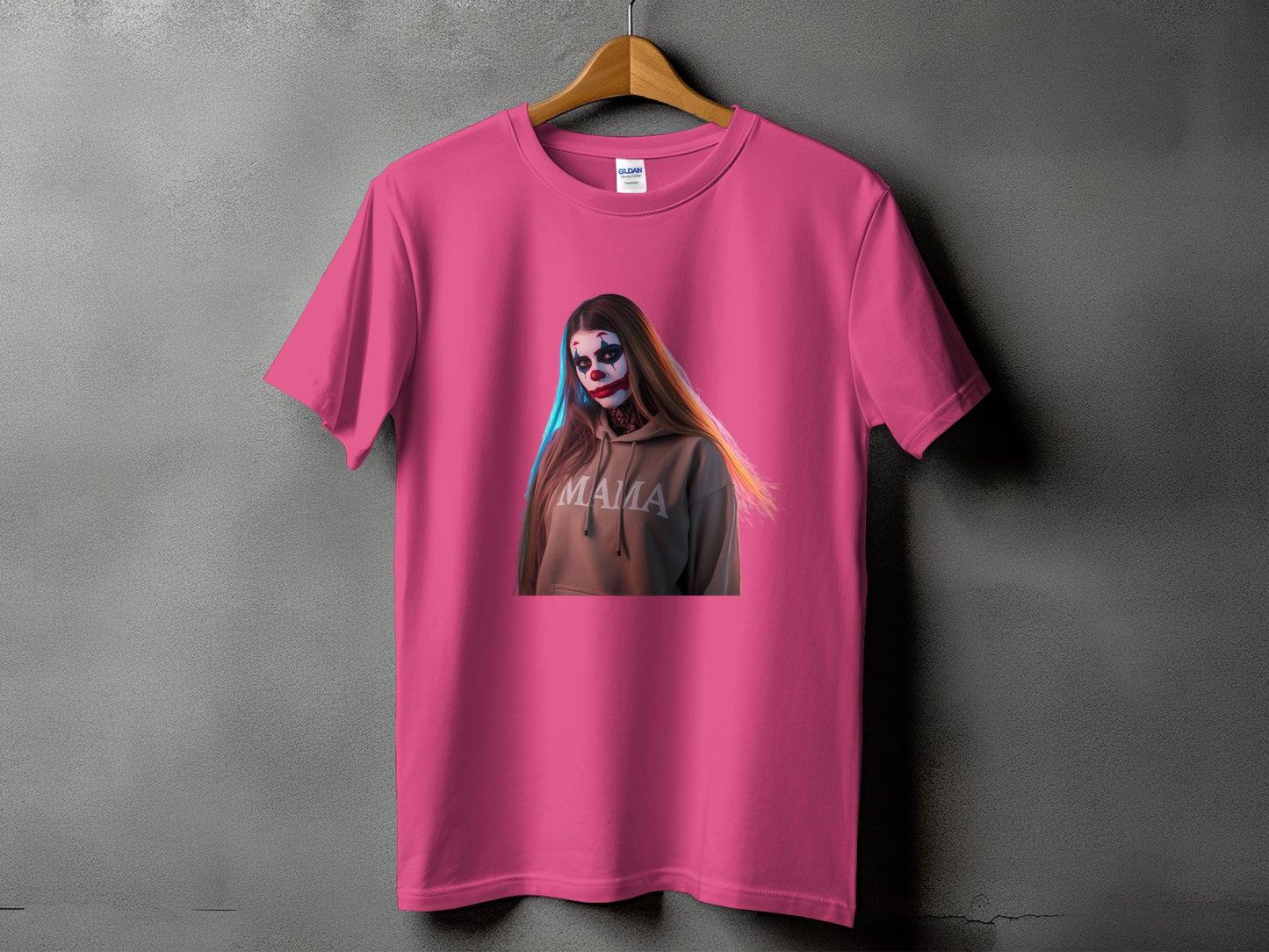 Pink t-shirt featuring a clown-faced woman in a hoodie with "MAMA" text.