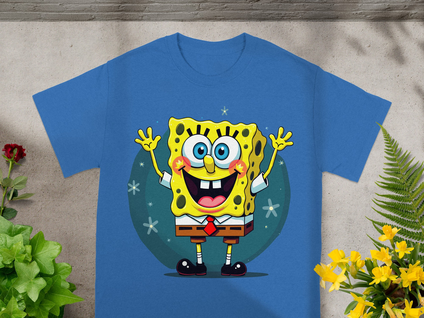Blue t-shirt featuring Spongebob Squarepants smiling with arms raised.