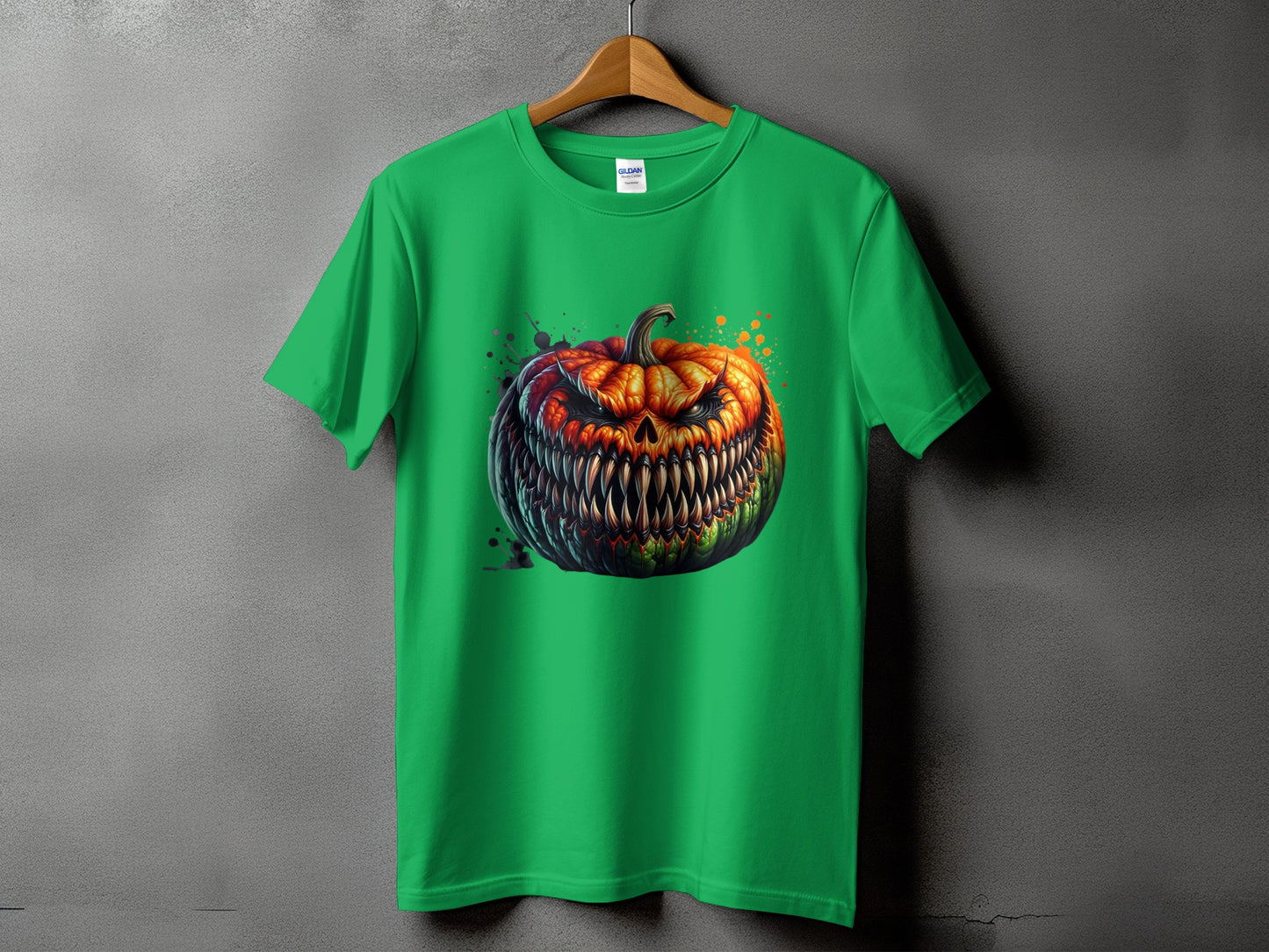 Green t-shirt with a scary jack-o'-lantern graphic and colorful paint splatters.
