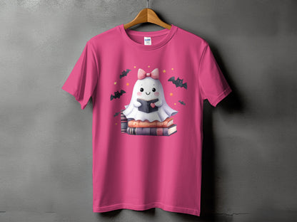 Pink t-shirt with a cute ghost reading a book on stacked books.