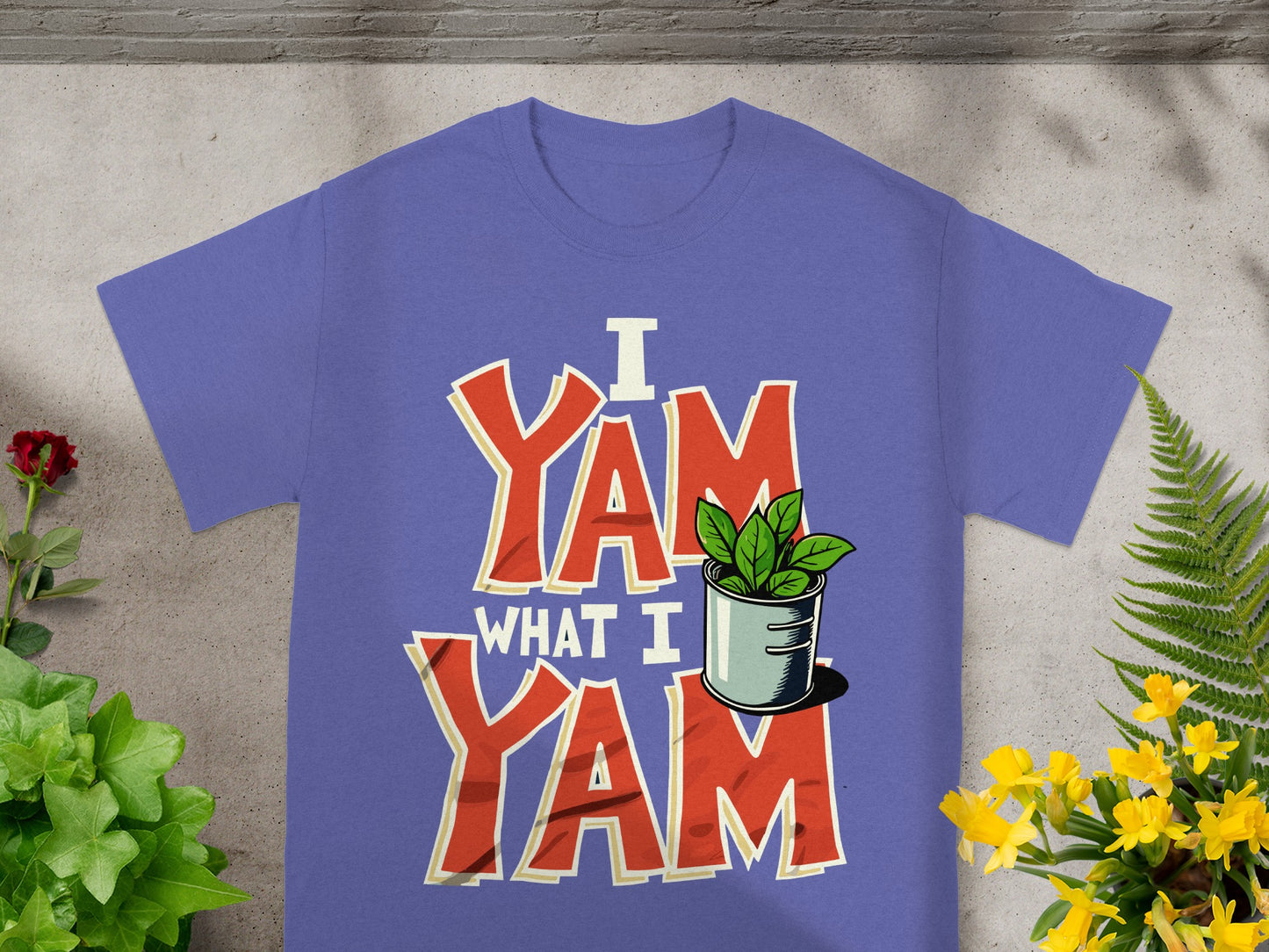 Purple t-shirt with "I Yam What I Yam" text and a potted plant graphic.