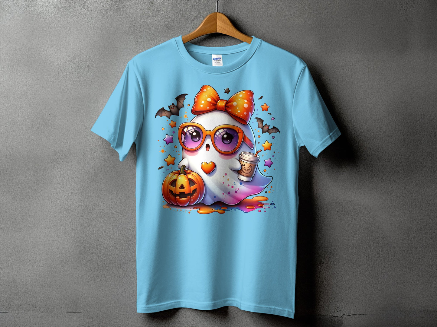 Light blue t-shirt with a cartoon ghost wearing glasses and an orange bow.