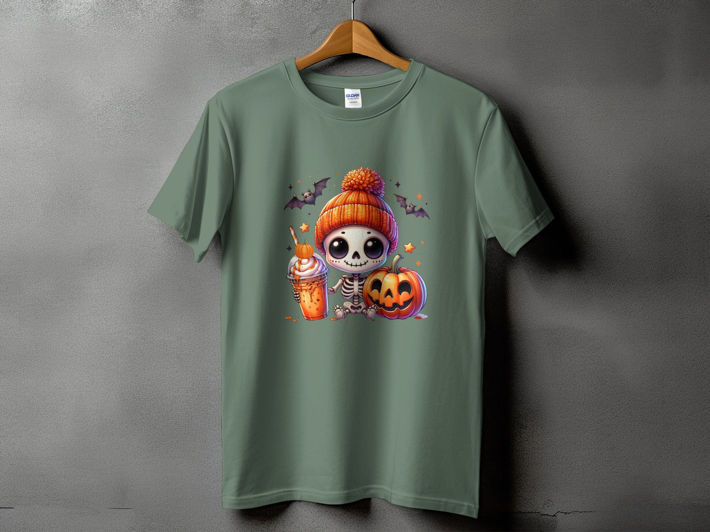 Green t-shirt with a cute skeleton, pumpkin, and drink graphic.