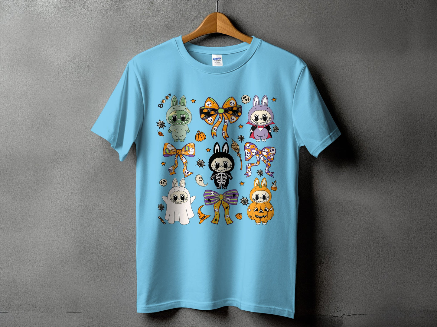 Light blue t-shirt with a Halloween-themed cartoon character print.