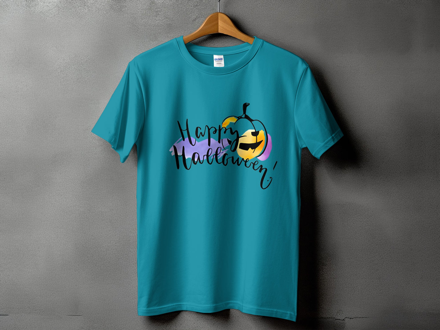 Teal t-shirt with "Happy Halloween" text and watercolor pumpkin graphic.