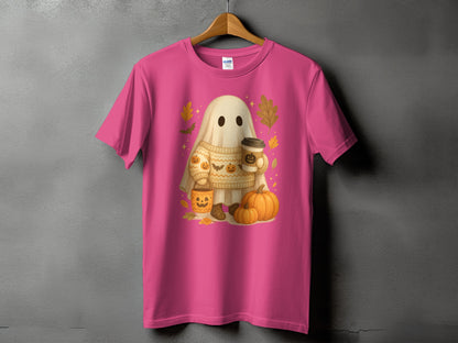 Pink t-shirt with a cartoon ghost holding coffee, surrounded by pumpkins and fall leaves.