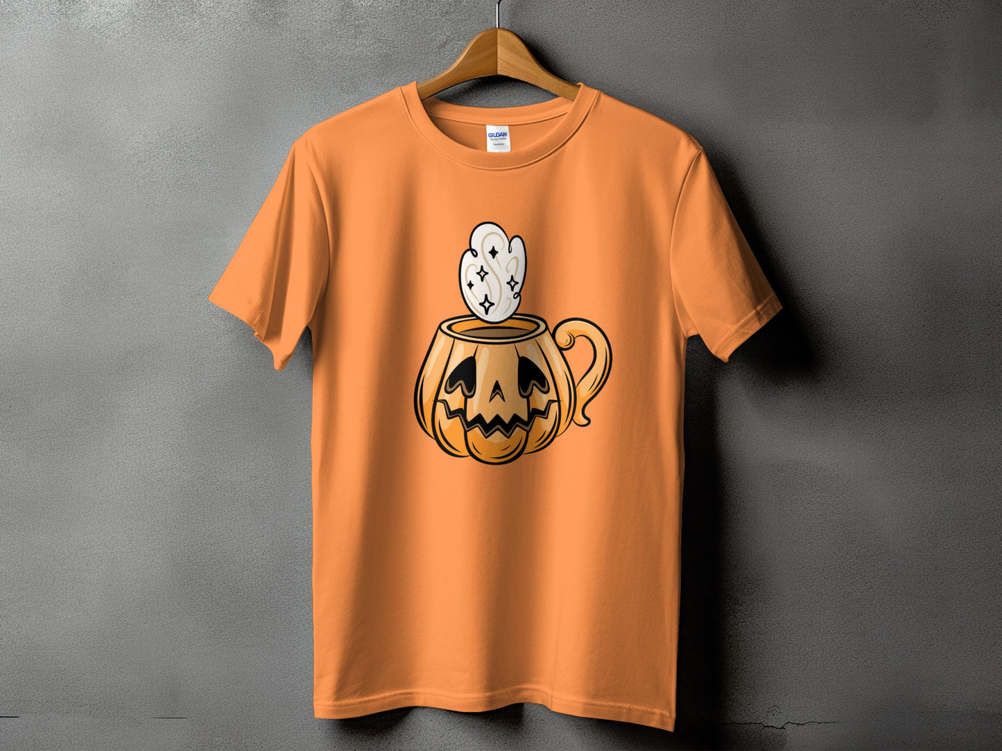 Orange t-shirt with jack-o'-lantern coffee cup graphic and steam.