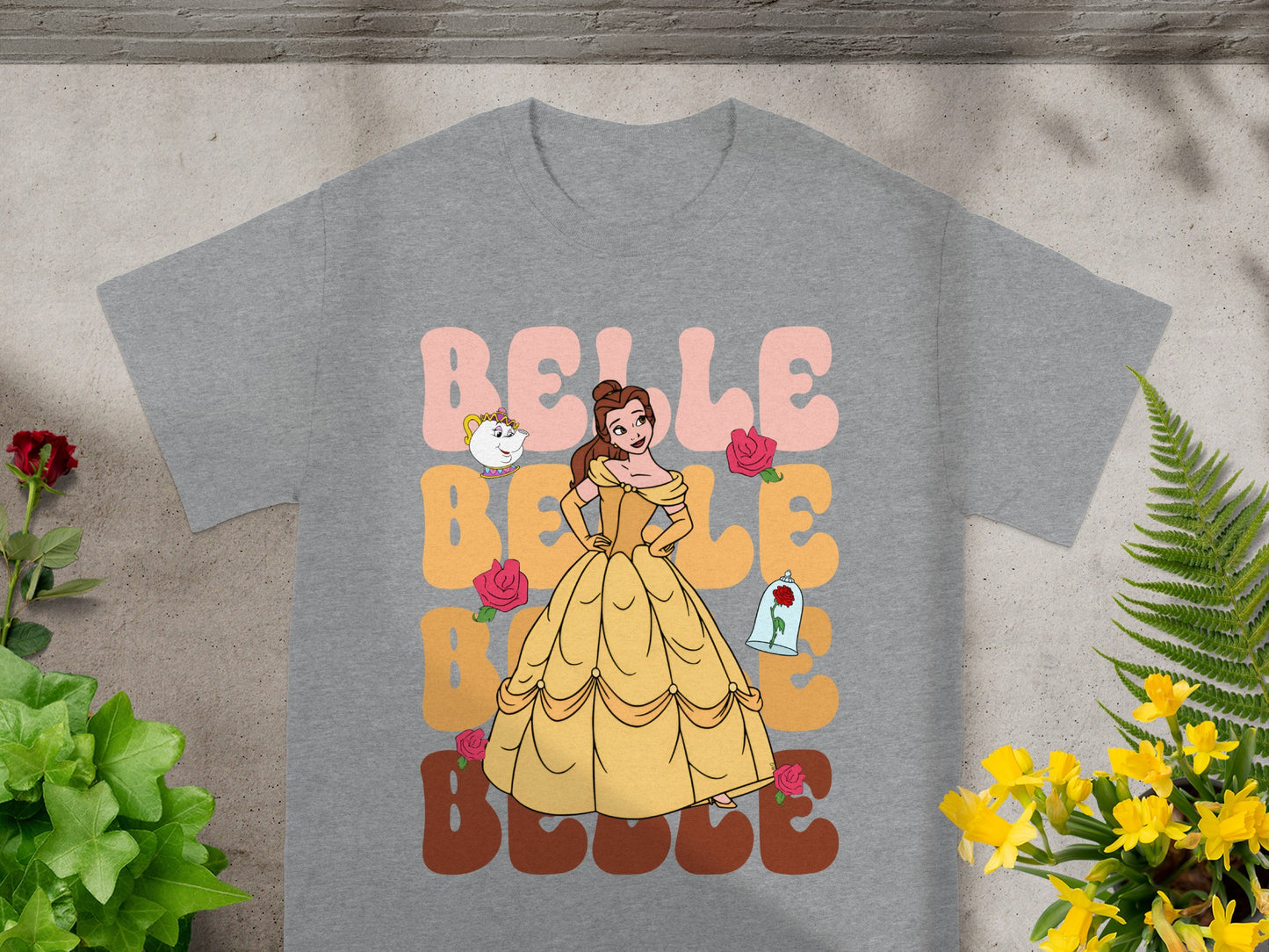 Belle in yellow dress with "BELLE" text and teacups.