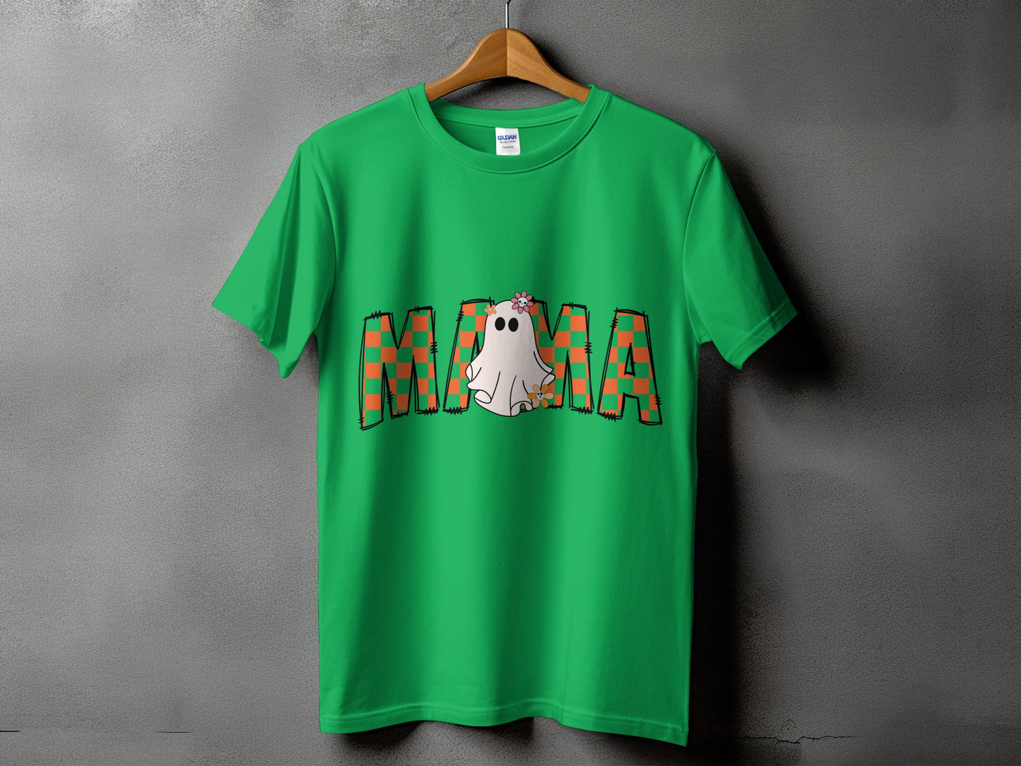 Green t-shirt with orange plaid "MAMA" text and a ghost graphic.