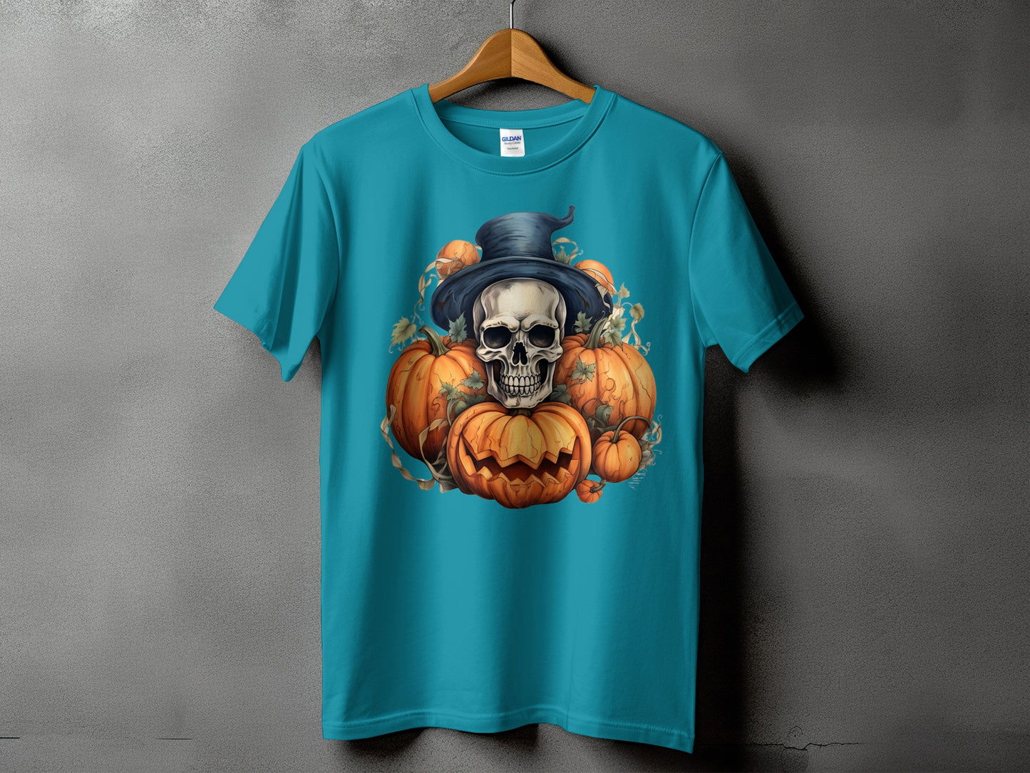 Teal t-shirt with skull and pumpkins Halloween graphic design.