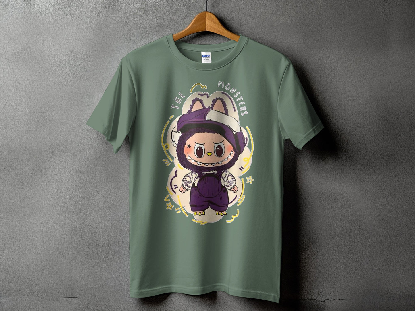 Green t-shirt with cartoon monster graphic and "THE MONSTERS" text.