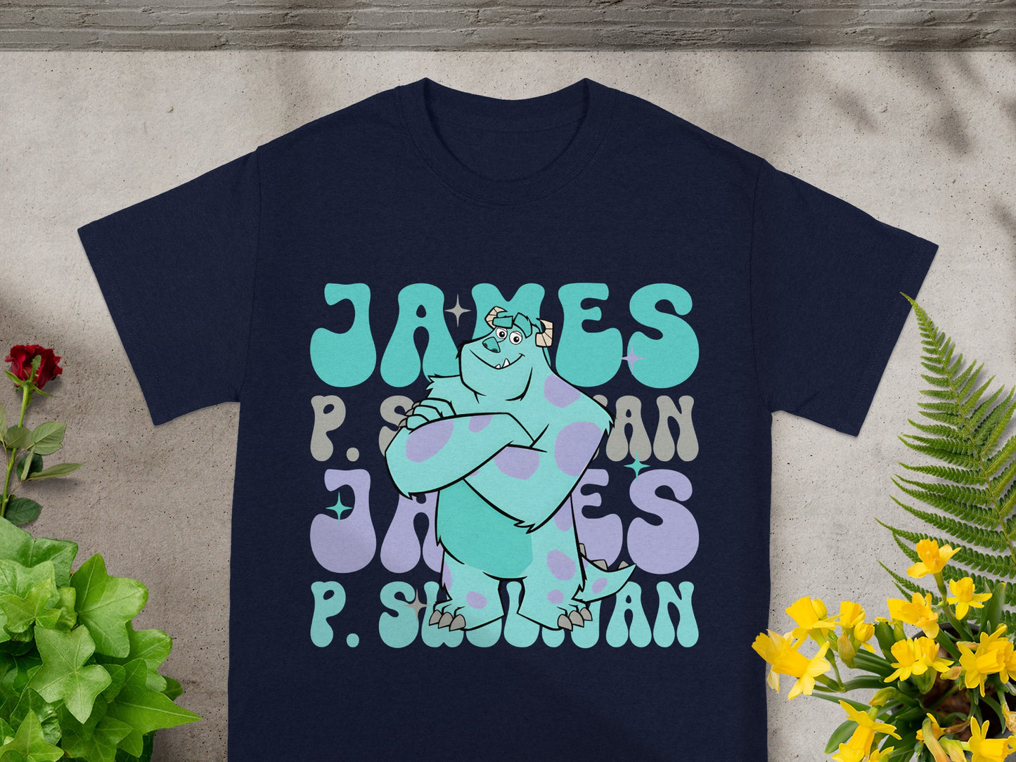 Navy t-shirt with "James P. Sullivan" graphic in retro font.