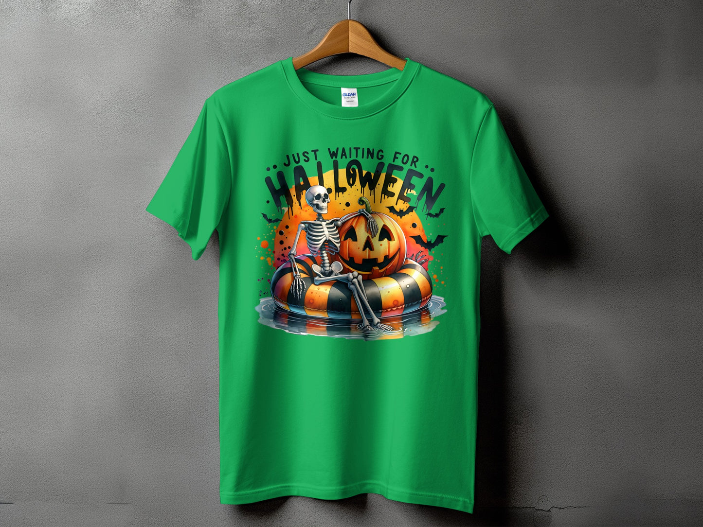 Green t-shirt with skeleton, pumpkin, and text "JUST WAITING FOR HALLOWEEN".