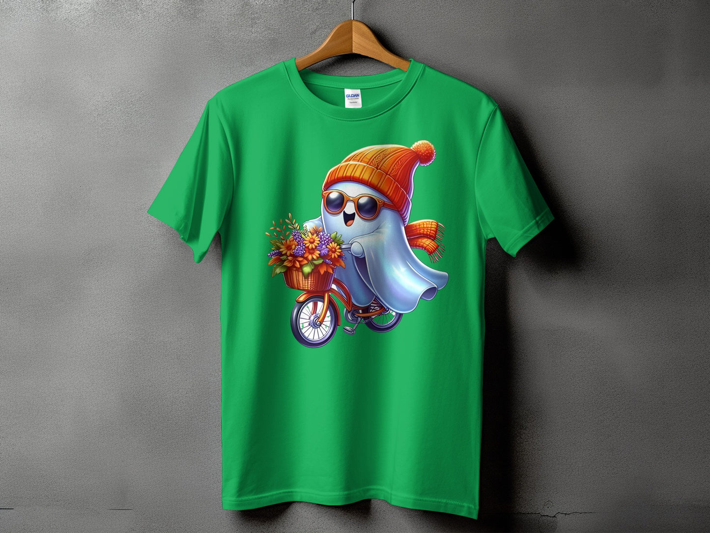 Green t-shirt with a cartoon ghost on a bicycle carrying flowers.