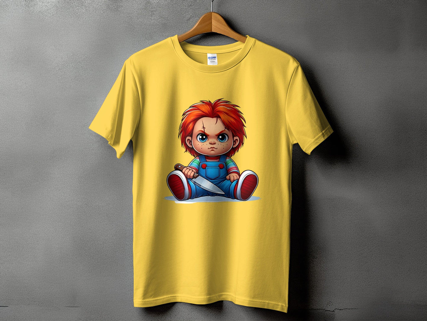 Yellow t-shirt with Chucky doll graphic holding a knife.
