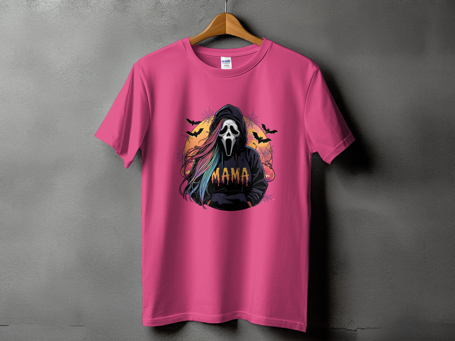 Pink t-shirt with a ghost mask, colorful hair, and "Mama" text graphic.