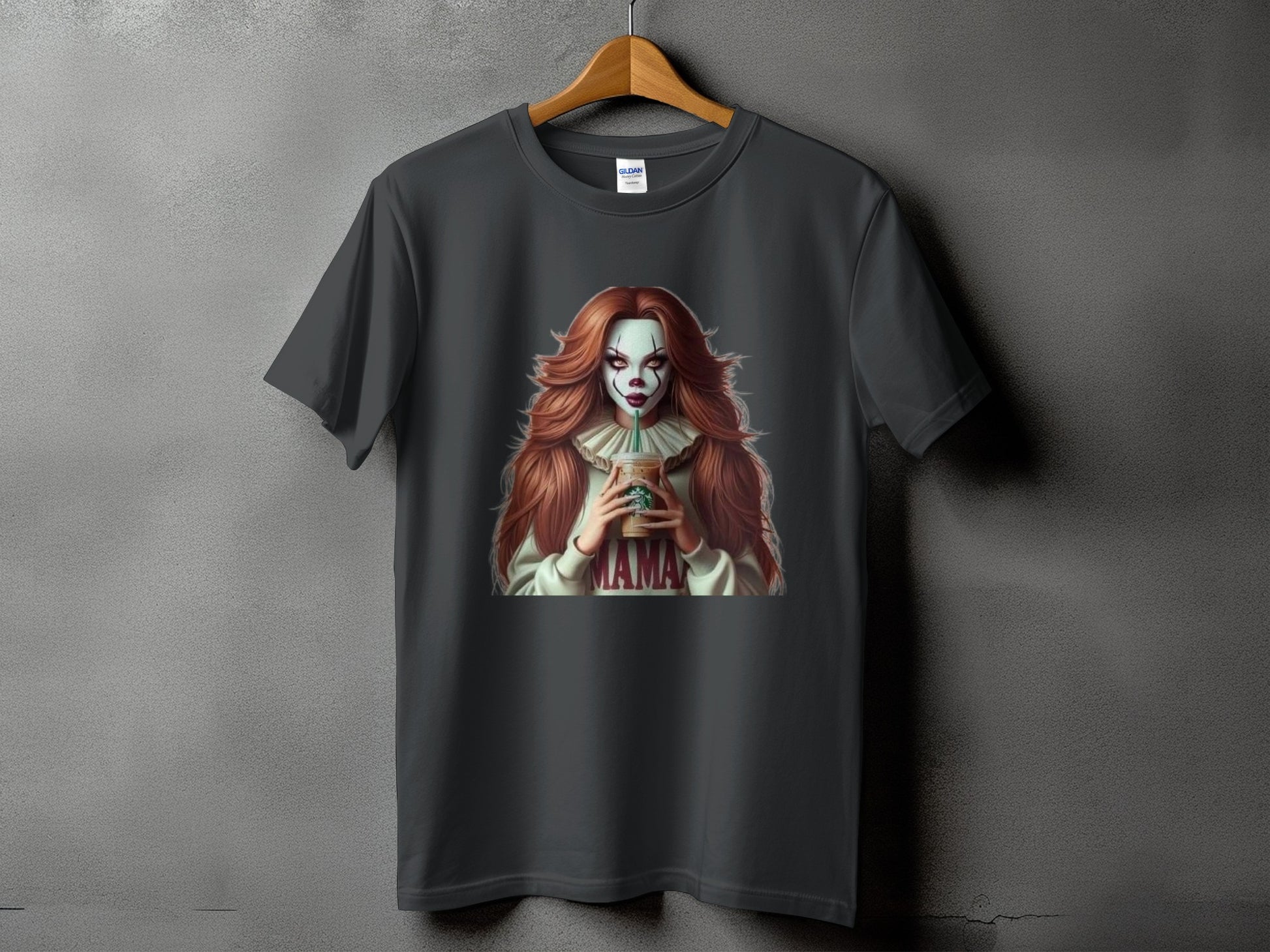 Dark grey t-shirt with a creepy clown character holding a coffee cup, "MAMA" text.