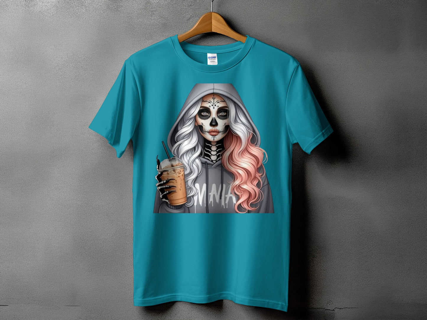 Teal t-shirt with a graphic of a skull-faced woman holding a drink.