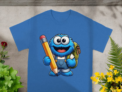 Blue t-shirt featuring cartoon Cookie Monster holding a large pencil and backpack.