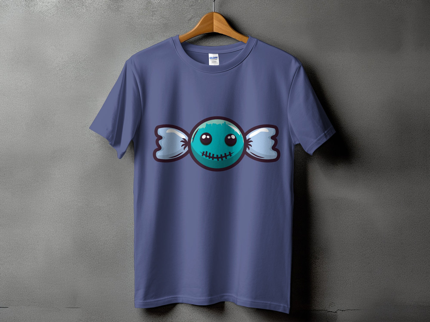 Purple t-shirt with a teal cartoon candy character with stitched mouth and eyes.