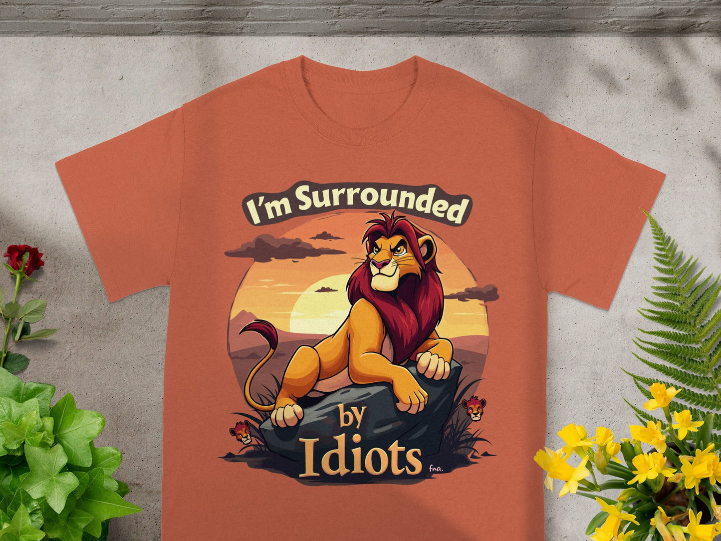 T-shirt with cartoon lion text "I'm Surrounded by Idiots"