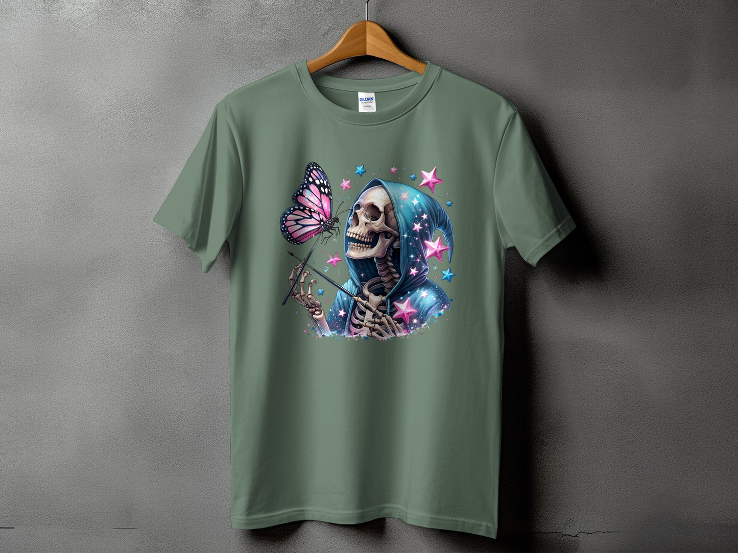 Skeleton in blue hoodie with butterfly and pink stars graphic on green t-shirt.