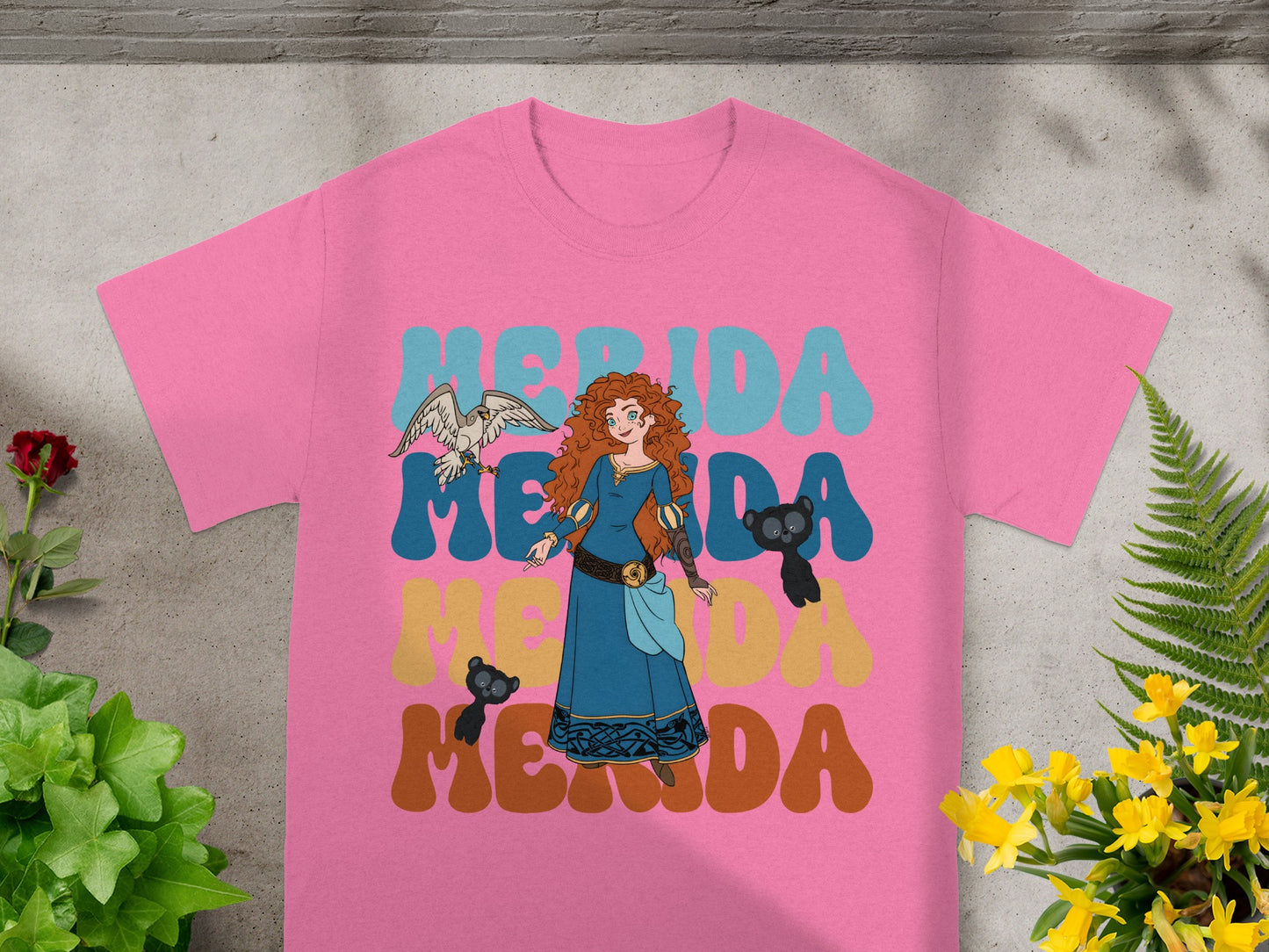 Merida from Brave on a pink t-shirt with text.