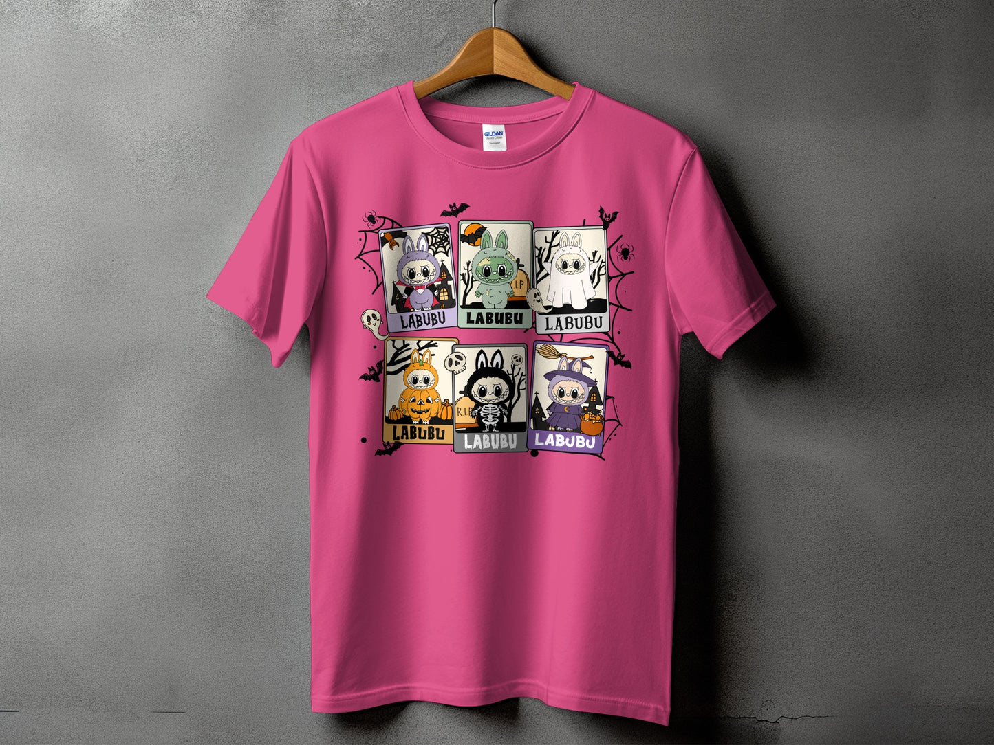 Pink t-shirt with six panels of cartoon Labubu characters in Halloween costumes.