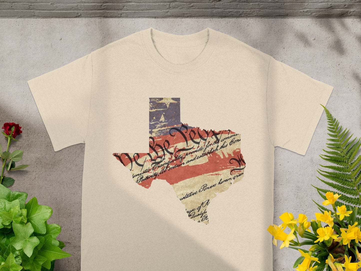 Texas map with US flag and text, on a cream t-shirt.