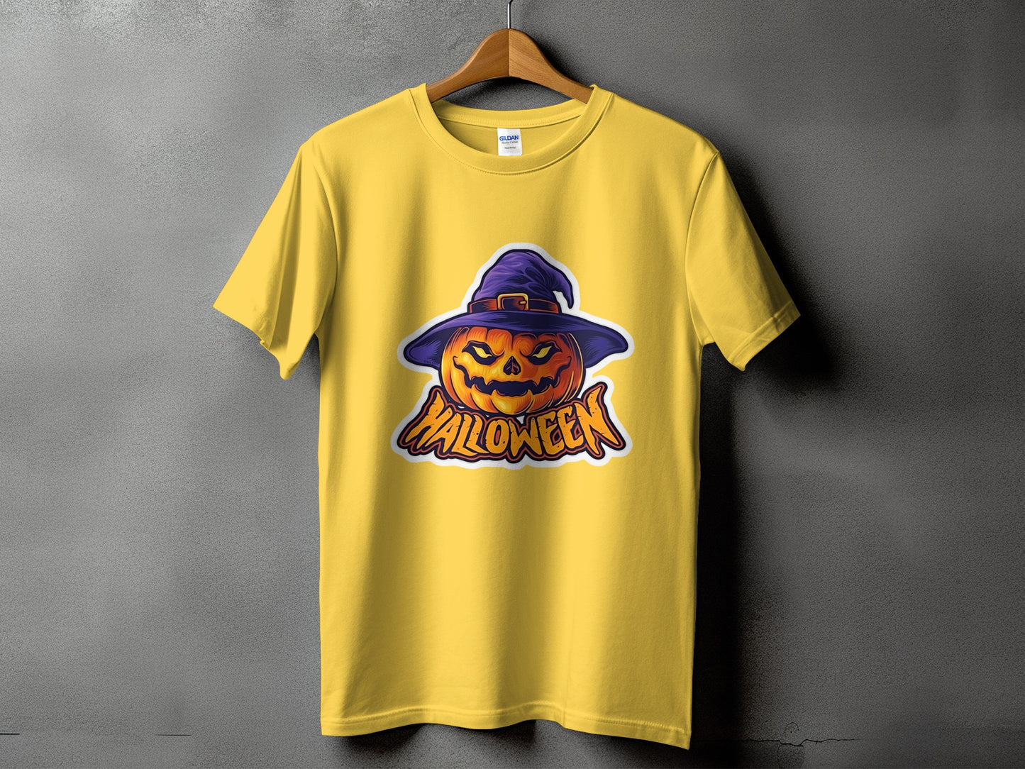 Yellow t-shirt with a cartoon jack-o'-lantern wearing a witch hat and the word "Halloween".