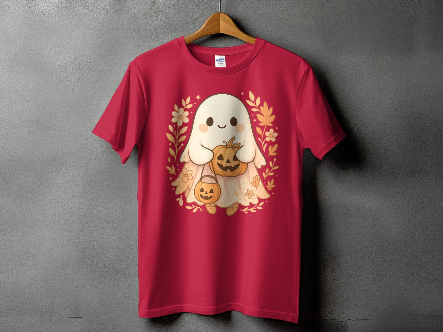 Red t-shirt with a cute ghost holding pumpkins and surrounded by fall leaves.