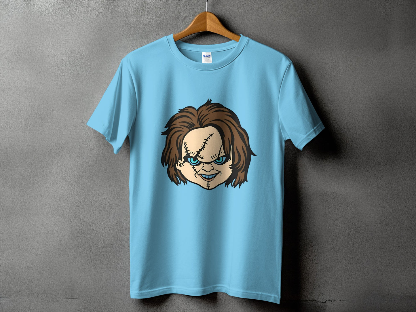 Light blue t-shirt with Chucky doll face graphic and Gildan tag.