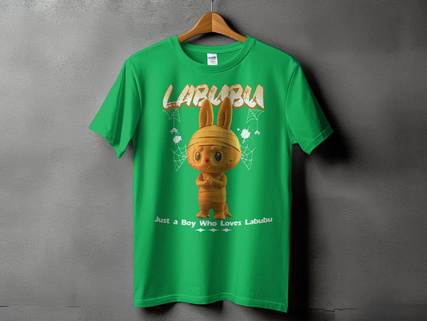 Green t-shirt with a mummy-like Labubu character and text "Just a Boy Who Loves Labubu".