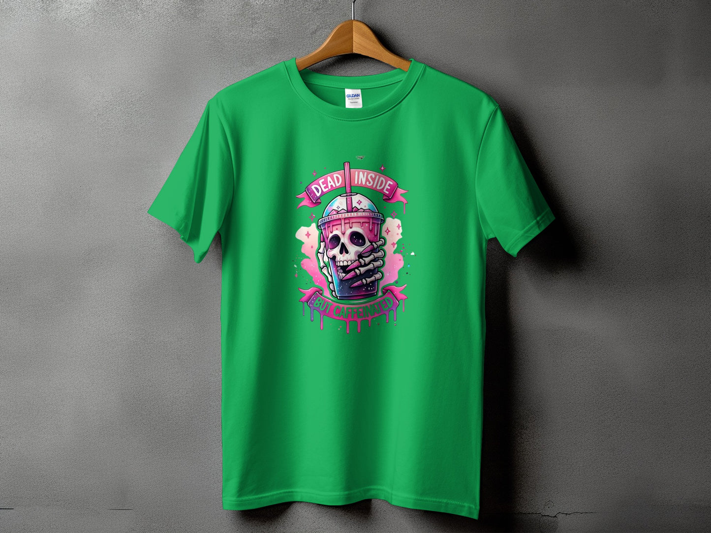 Green t-shirt with skull holding a drink and text that reads "DEAD INSIDE BUT CAFFEINATED".