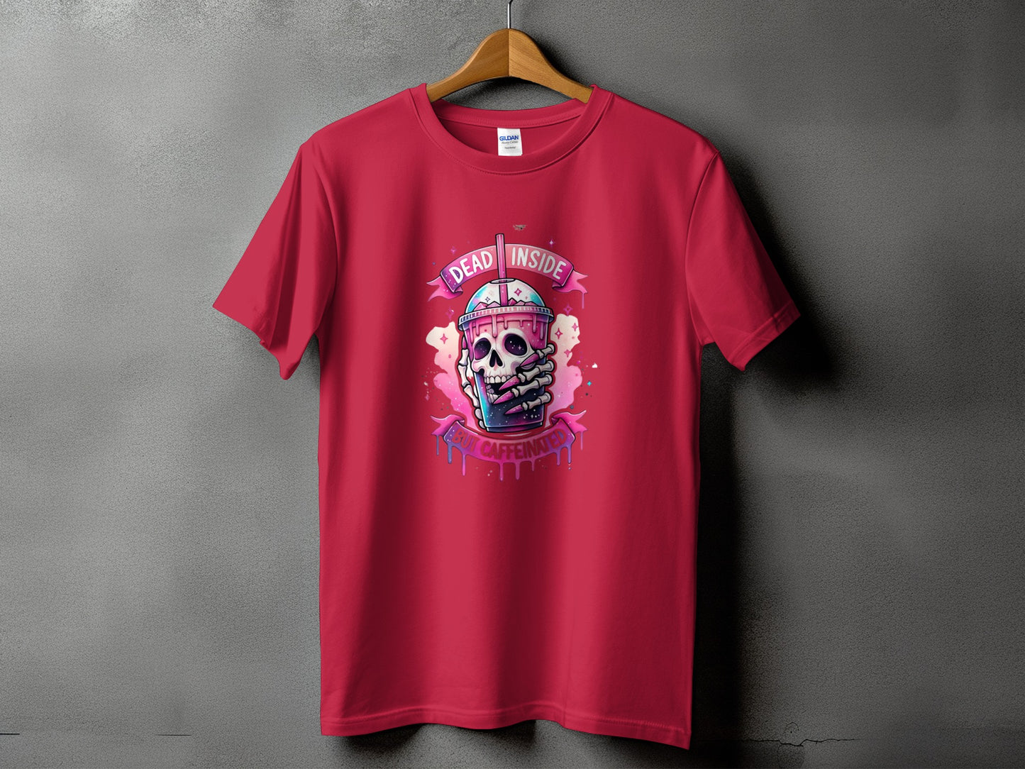 Red t-shirt with graphic of skull holding coffee cup, text "DEAD INSIDE BUT CAFFEINATED".